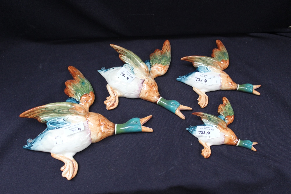 A set of four Beswick flying wall ducks