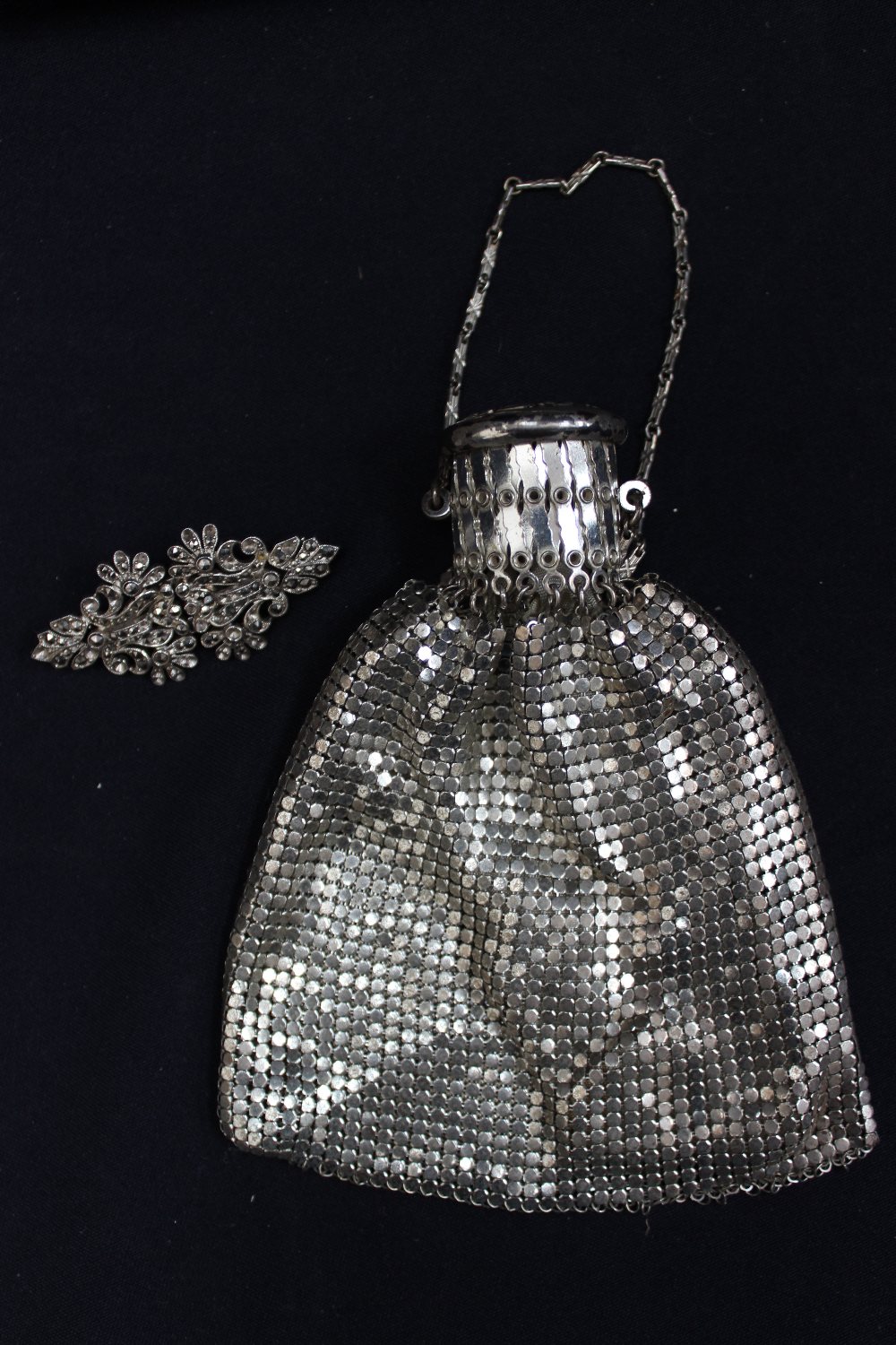 A ladies metal evening bag and cloak, double clasp.