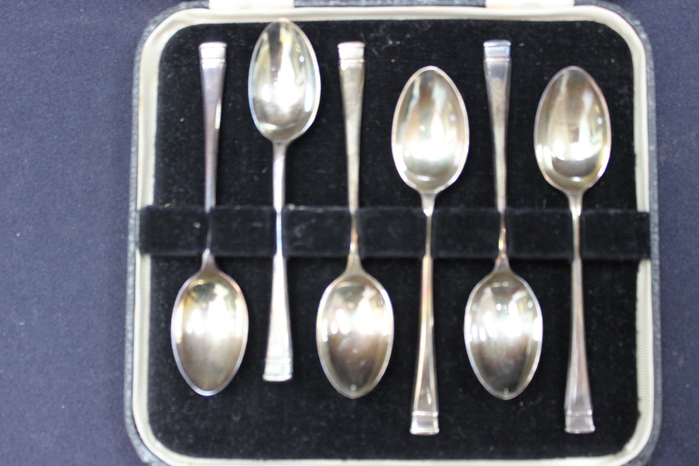 A boxed set of silver teaspoons