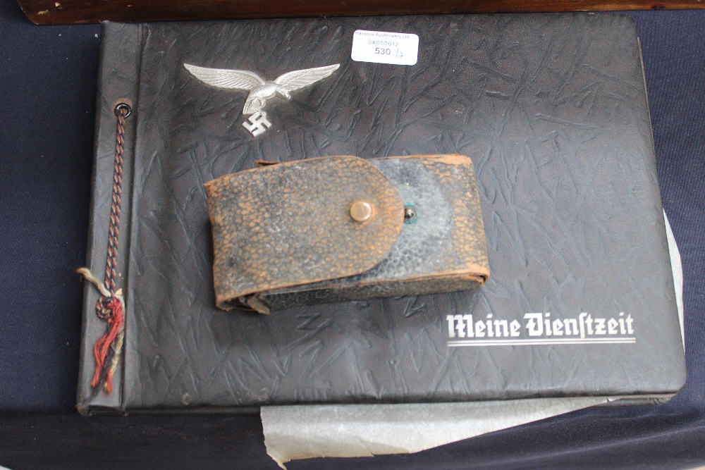 Nazi photo album and early camera in leather case