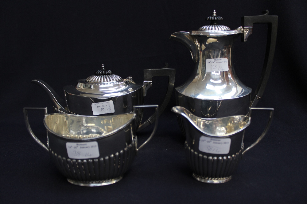 A Victorian silver four-piece tea set, comprising teapot, hot water, sugar and milk, Sheffield 1897,