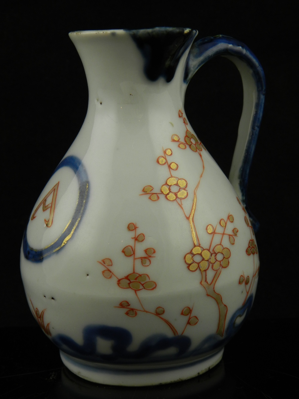 A Chinese 19th century porcelain sparrow beak cream jug, having gilt enriched floral decoration.