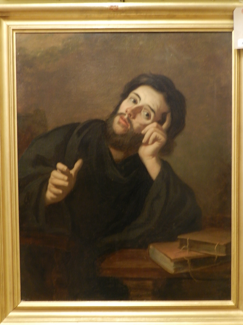19th century Continental school, a half length portrait of a monk in habit, deep in scholarly