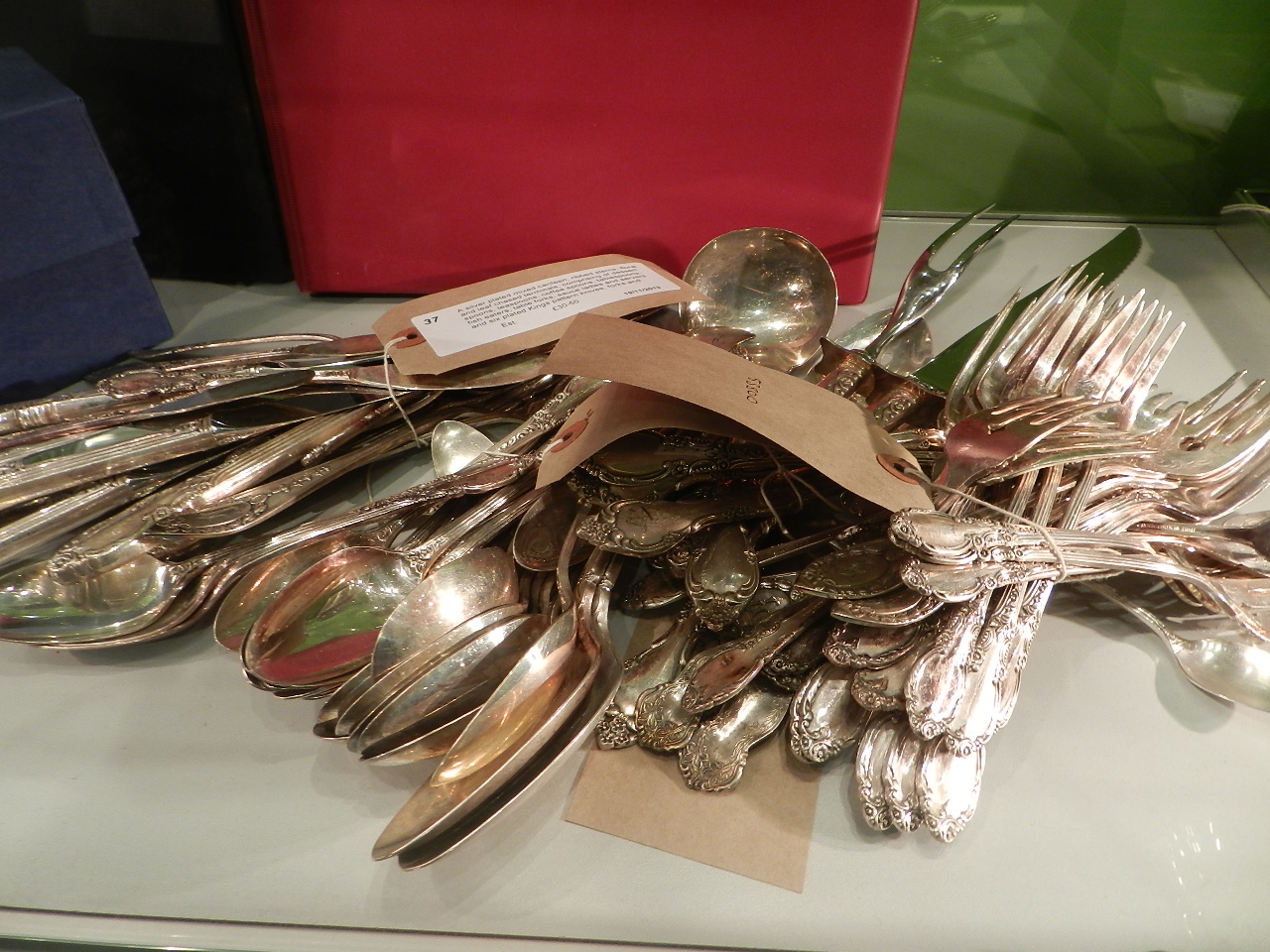 A silver plated mixed canteen, ribbed stems, floral and leaf chased terminals, comprising of dessert