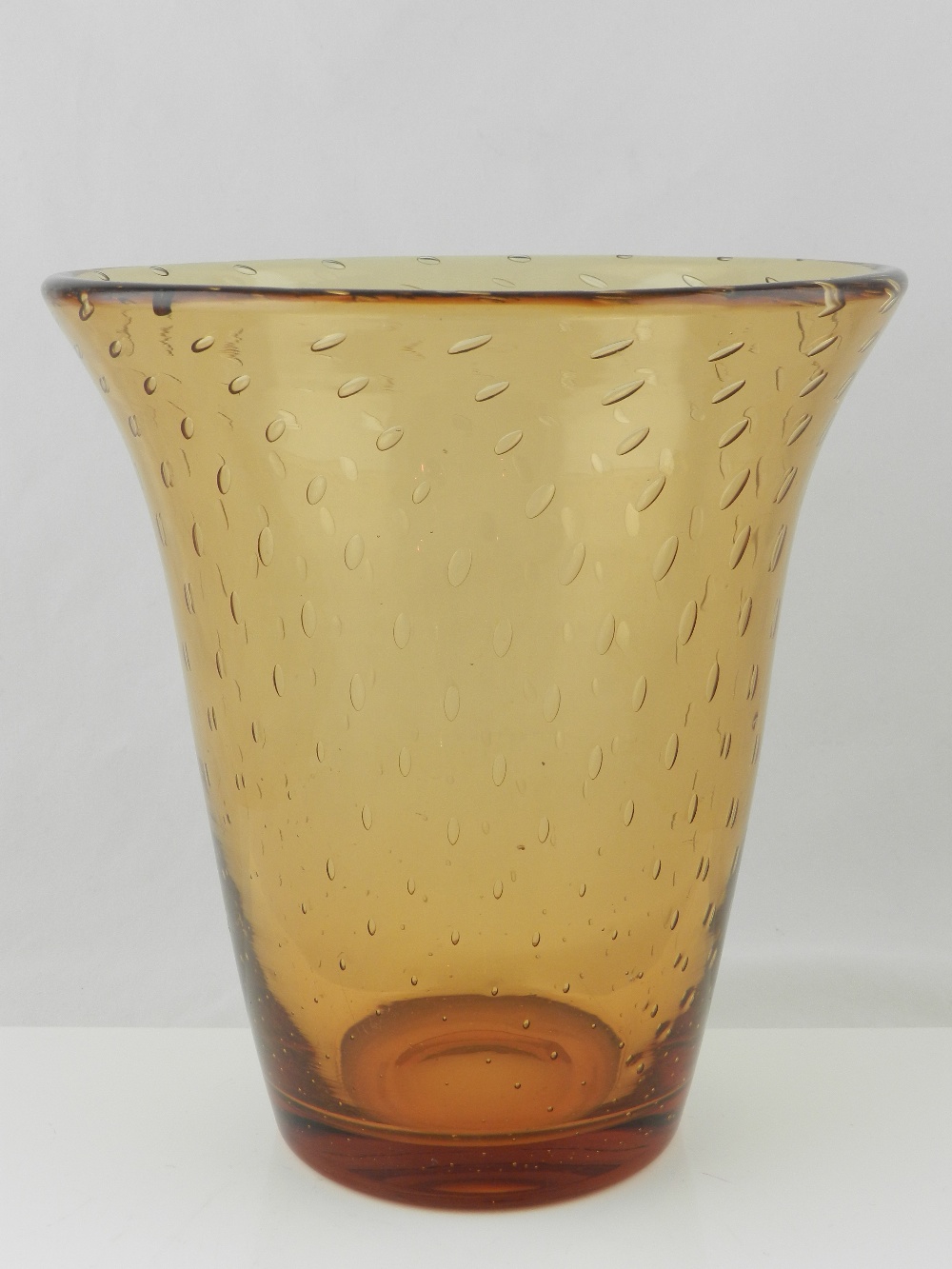 Whitefriars, London. A 'Bubble Control' amber art glass vase of flared form.