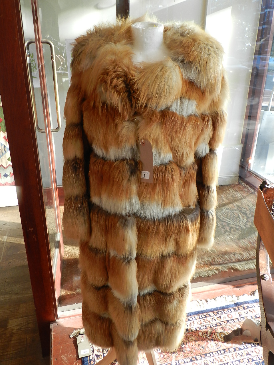 A 1970's red fox ladies 3/4 fur coat, size 10/12.