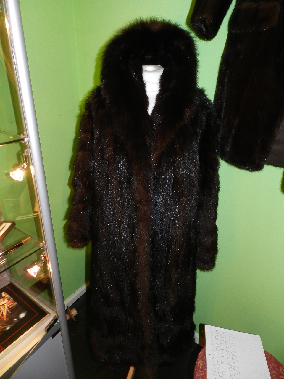 Calman Links, London. A full length ladies chocolate brown fur coat.