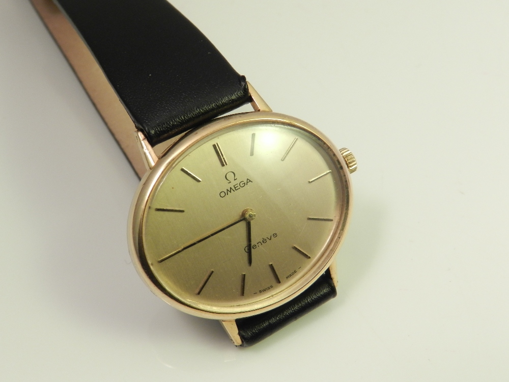 An Omega gilt metal cased ladies watch, set on a black strap.