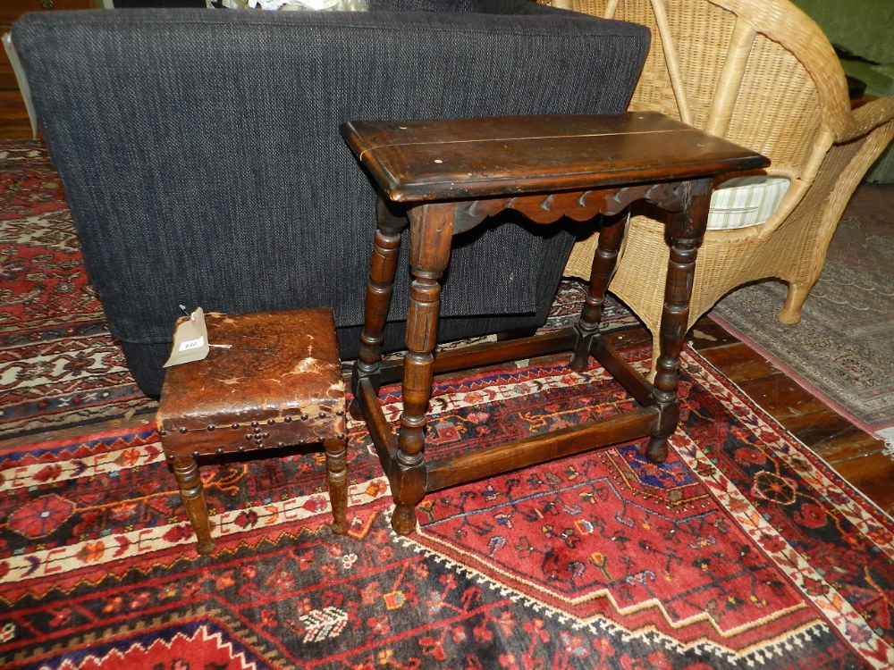 A small square footstool with turned legs, together with a rectangular table having a scalloped