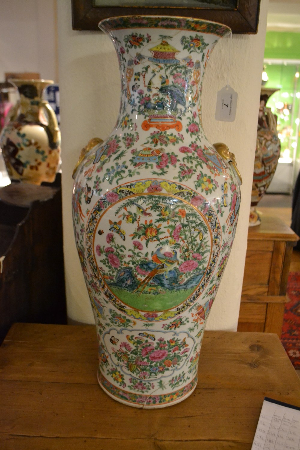 A 19th century Canton porcelain baluster vase, decorated in the famille rose palette, with