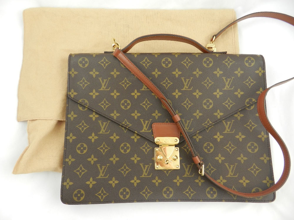 A Louis Vuitton brown monogrammed leather satchel with yellow metal mounts, padlock and key, with