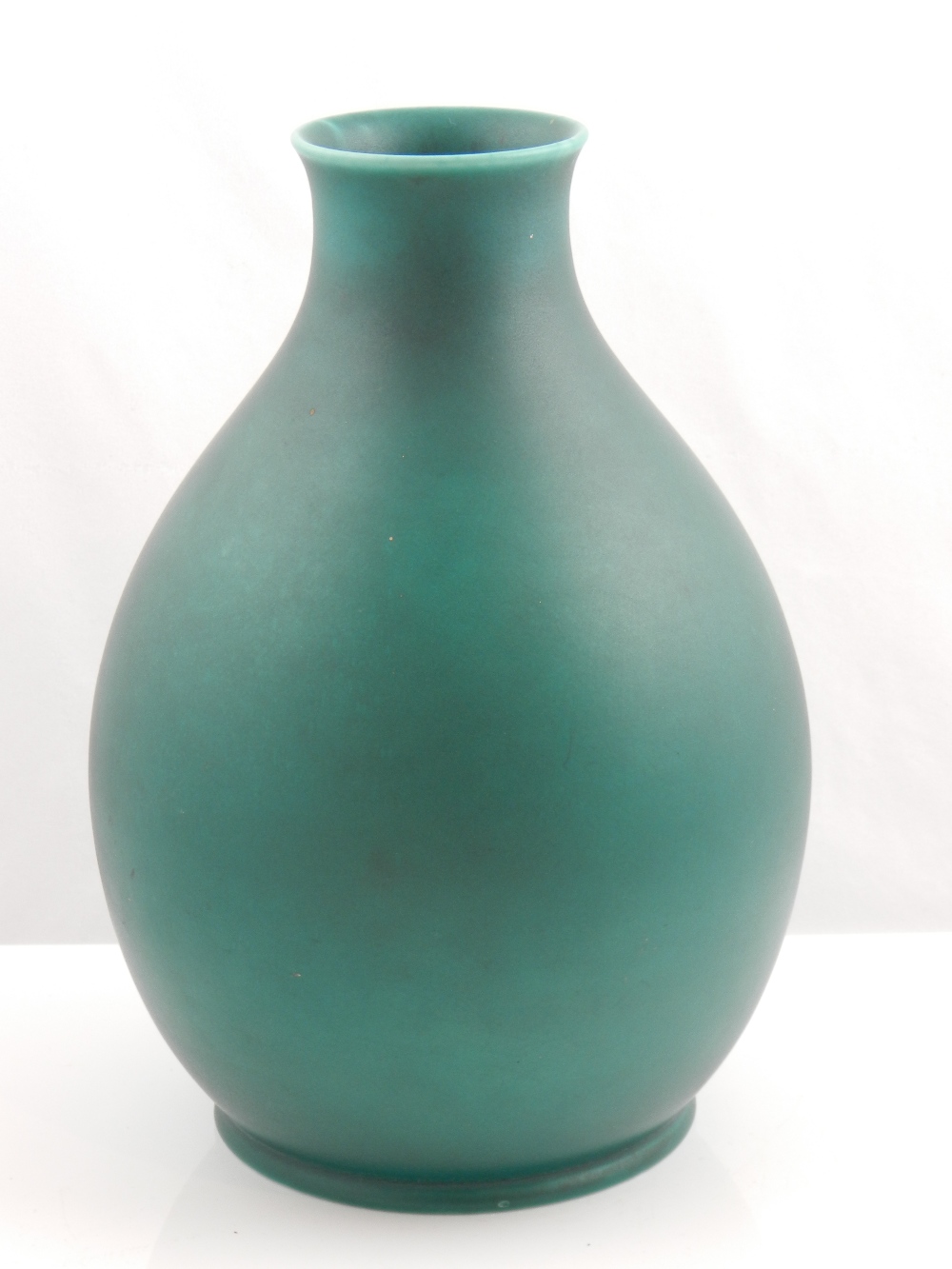 A Royal Lancastrian green glazed vase of compressed pear shape, on rim foot, stamped to the base