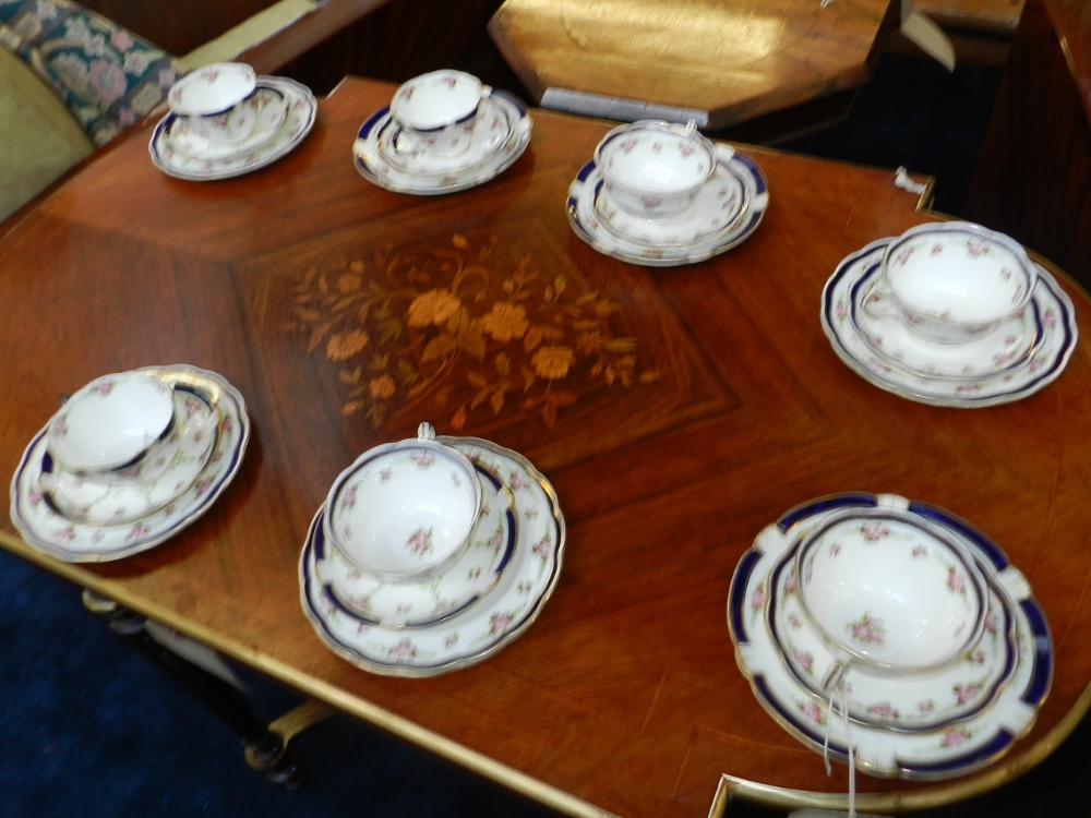 A Crescent & Sons part tea and coffee service, decorated with flowers and having a gilt and blue