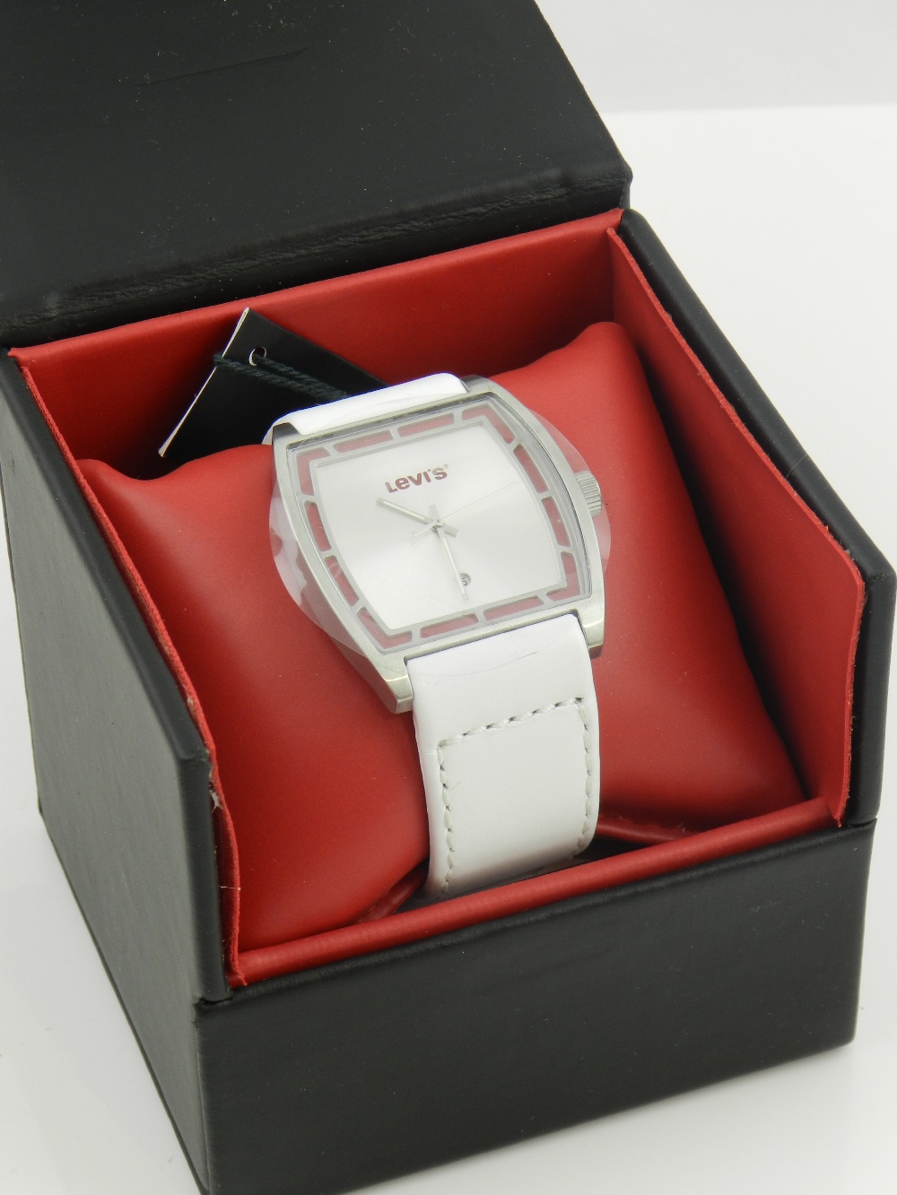 A 'Levis' gentlemen's wristwatch with red and silvered dial, in original case with documents.