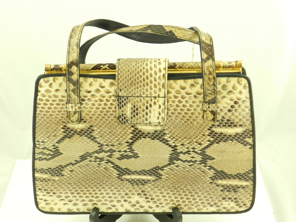 A python skin handbag, trimmed in black leather.