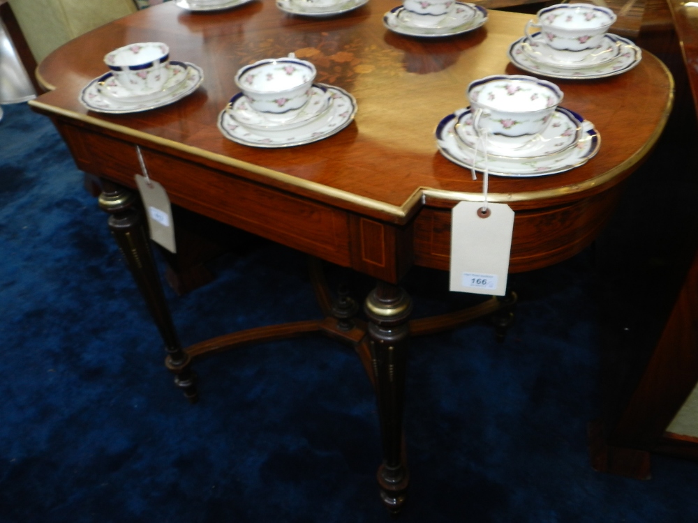 A Louis XVI style rosewood centre table, gilt metal mounted, the top centred with floral