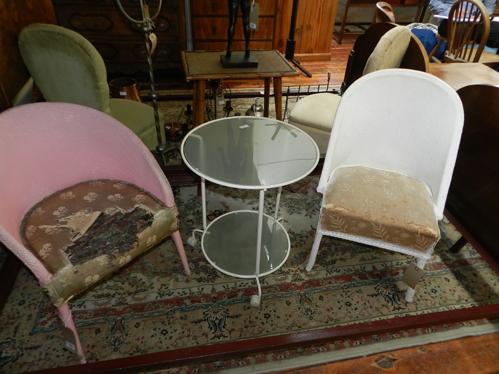 Two Loyd Loom style chairs in need of reupholstery. One painted pink and the other white.