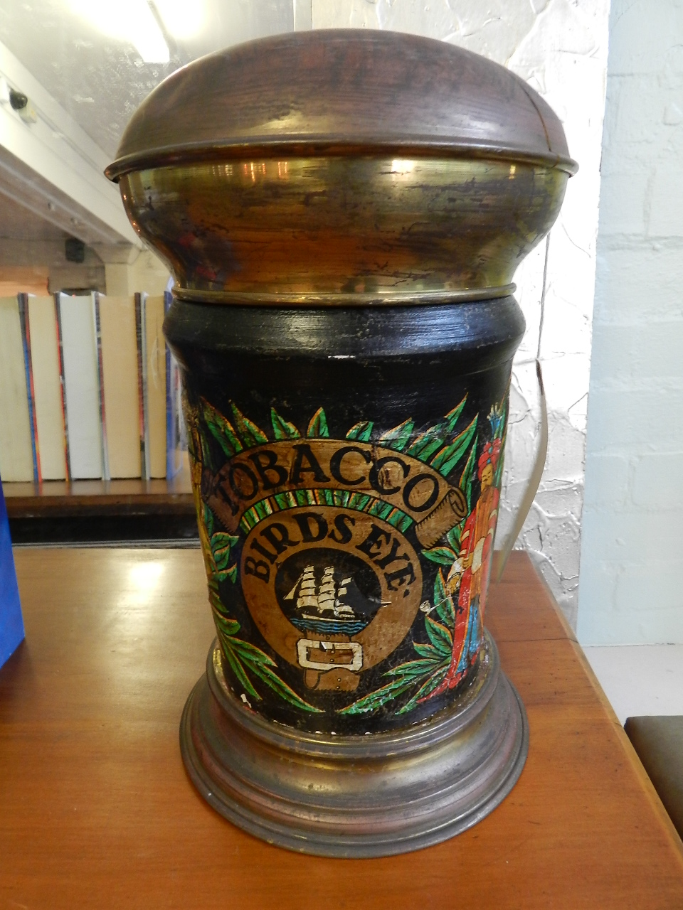 A pair of  tobacco jars having painted ceramic bodies mounted on brass base and lids, Honeydew and