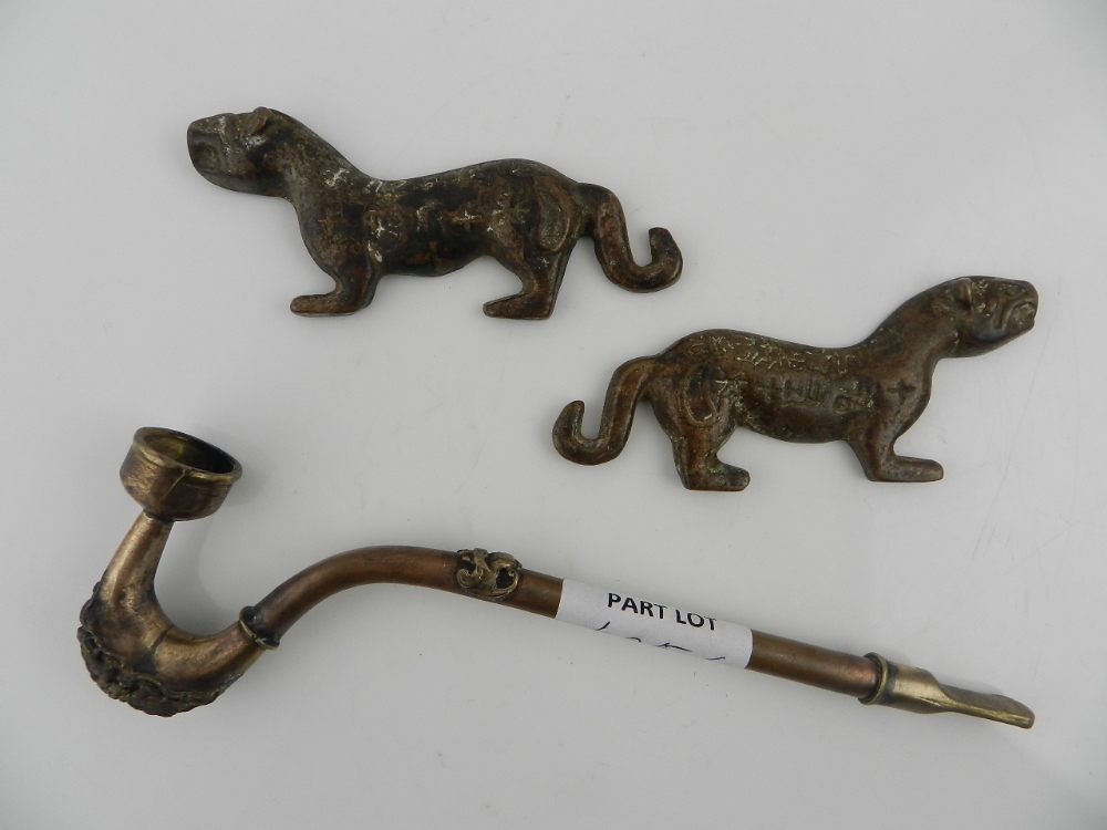 A Chinese cast bronze tiger 'Fu,' and a copper and bronze opium pipe.