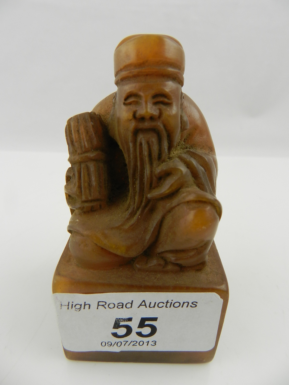 A Chinese soapstone seal carved with a seated elder