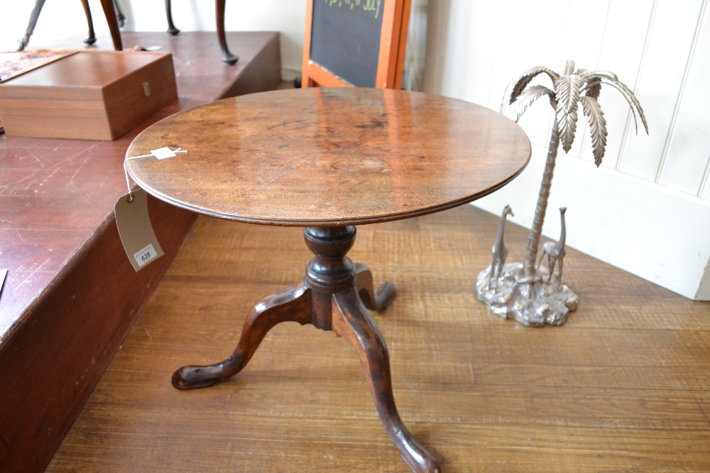 A 19th century mahogany occasional table on vase form support above three out swept legs. 60 x 51cm.