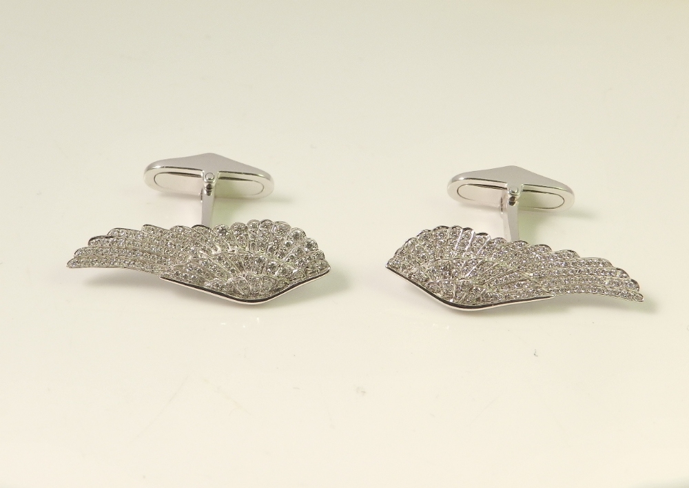 A pair of Garrards 18ct white gold and pave set diamond mounted cufflink's of wing form