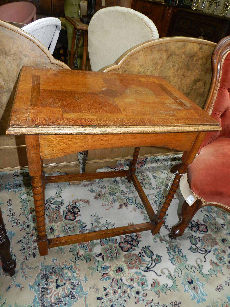 A late Victorian oak occasional rectangular table having four barley twist column legs on