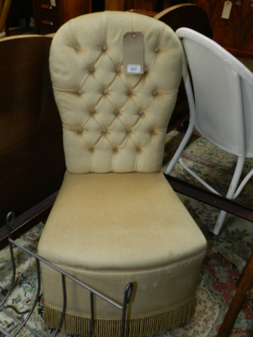 A matched pair of button back upholstered bedroom nursing chairs.