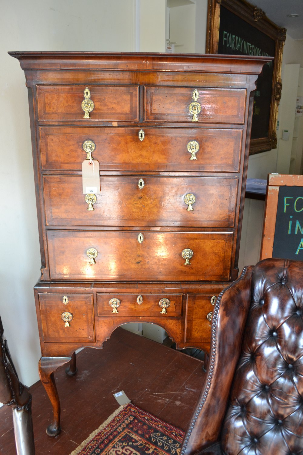An 18th century rectangular walnut tallboy with fluted inset columns flanking two short drawers over