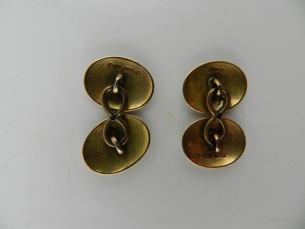 A pair of gentleman's Victorian 15ct gold cufflink's of oval form decorated with chased floral