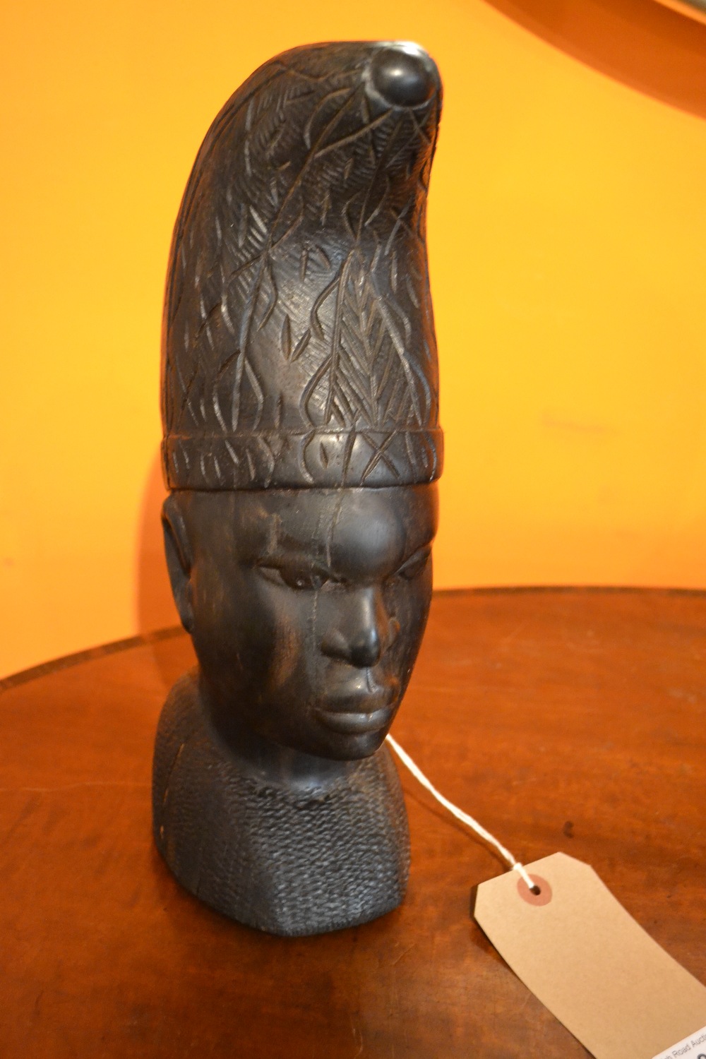 An African carved hardwood bust of a man