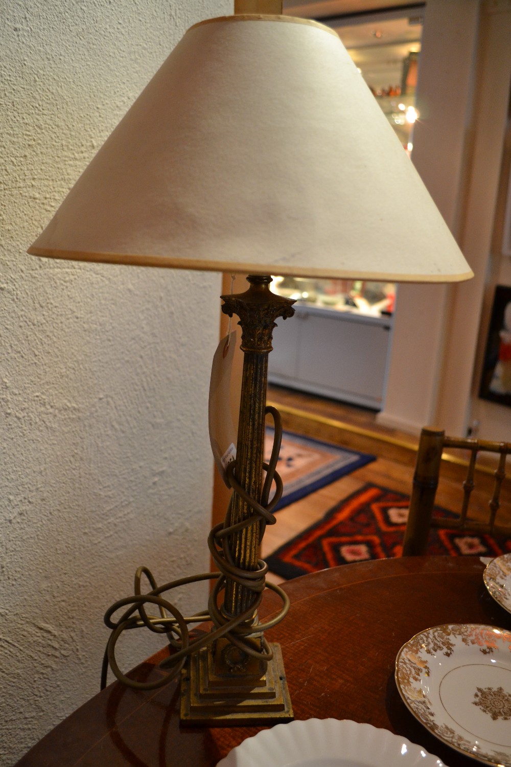 A gilded metal table lamp of Corinthian column form