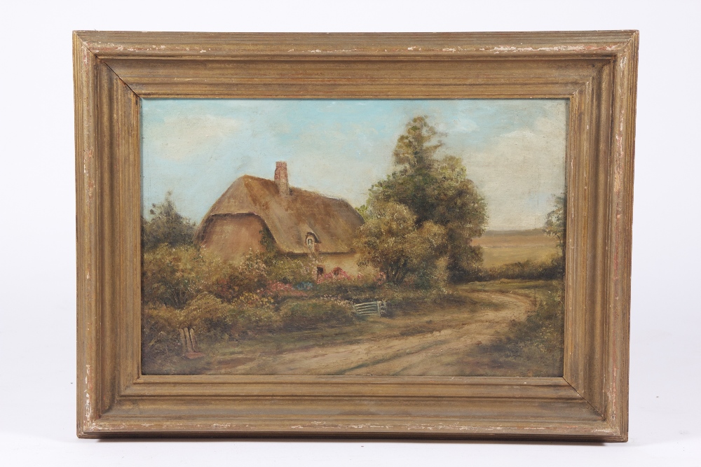 A romantic oil on board depicting a thatched country cottage, 46 x 31 cm.