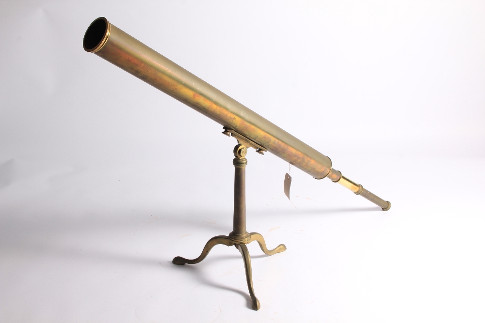 An antique solid brass telescope on a tripod stand by Armstrong of Manchester, 135 cm long.