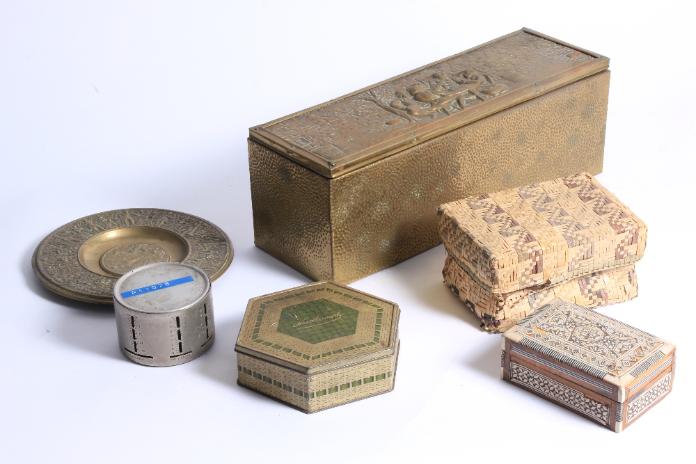 A collection of metal boxes and containers and inkwells.