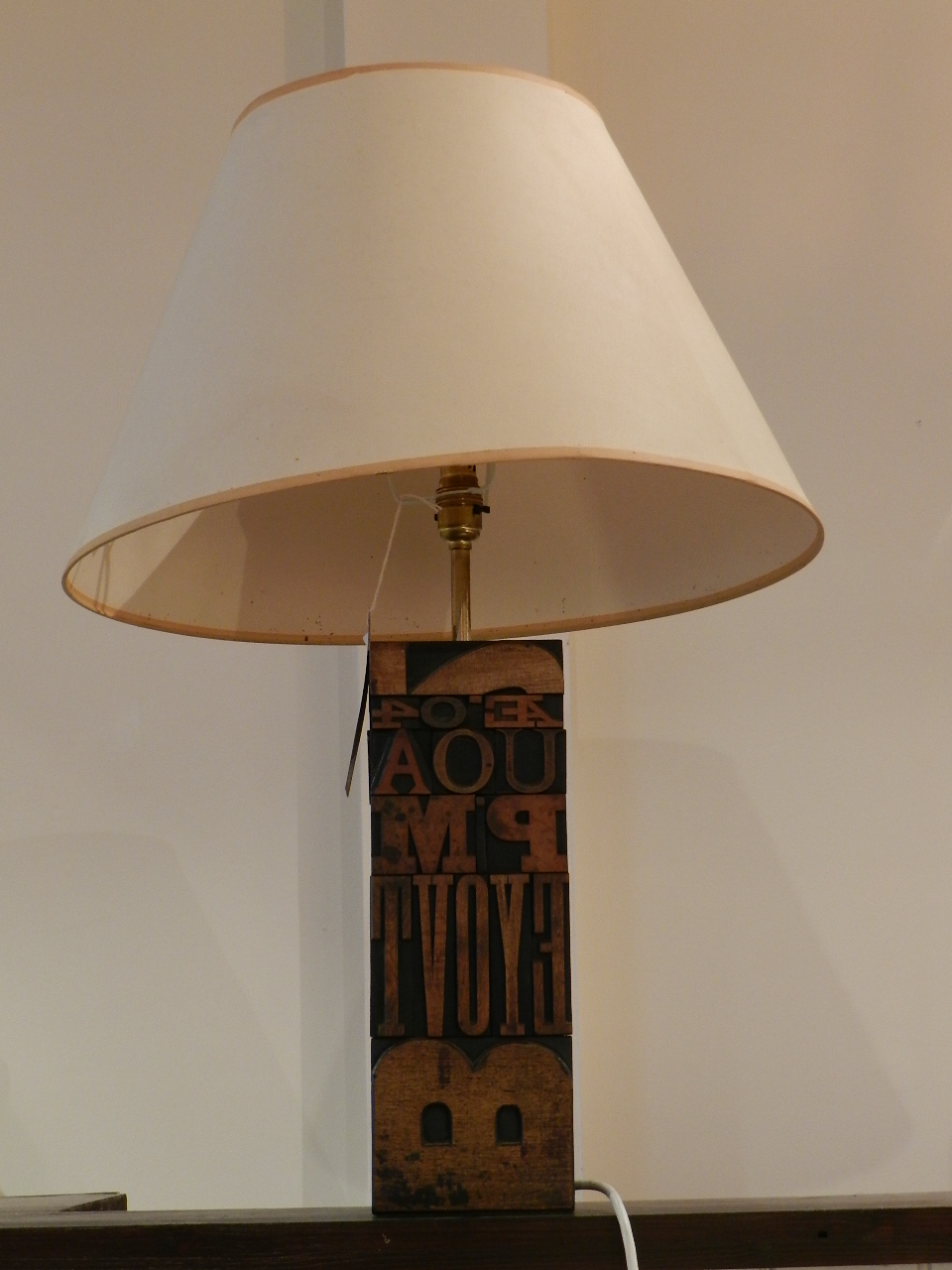 Occasional table lamp made of printing blocks, with ivory shade.