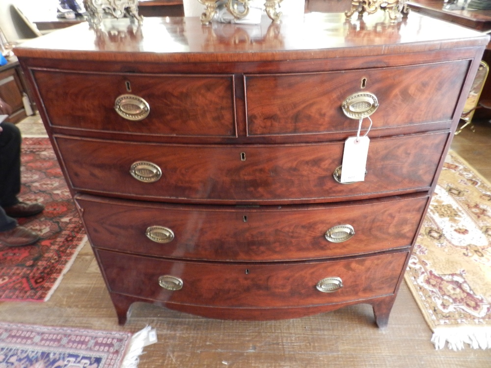 A 19th century flame mahogany bow fronted chest of two short over three long graduated drawers