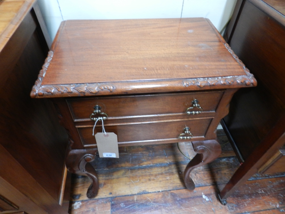 A pair of teak pedestal chests of two drawers raised on cabriole supports.
