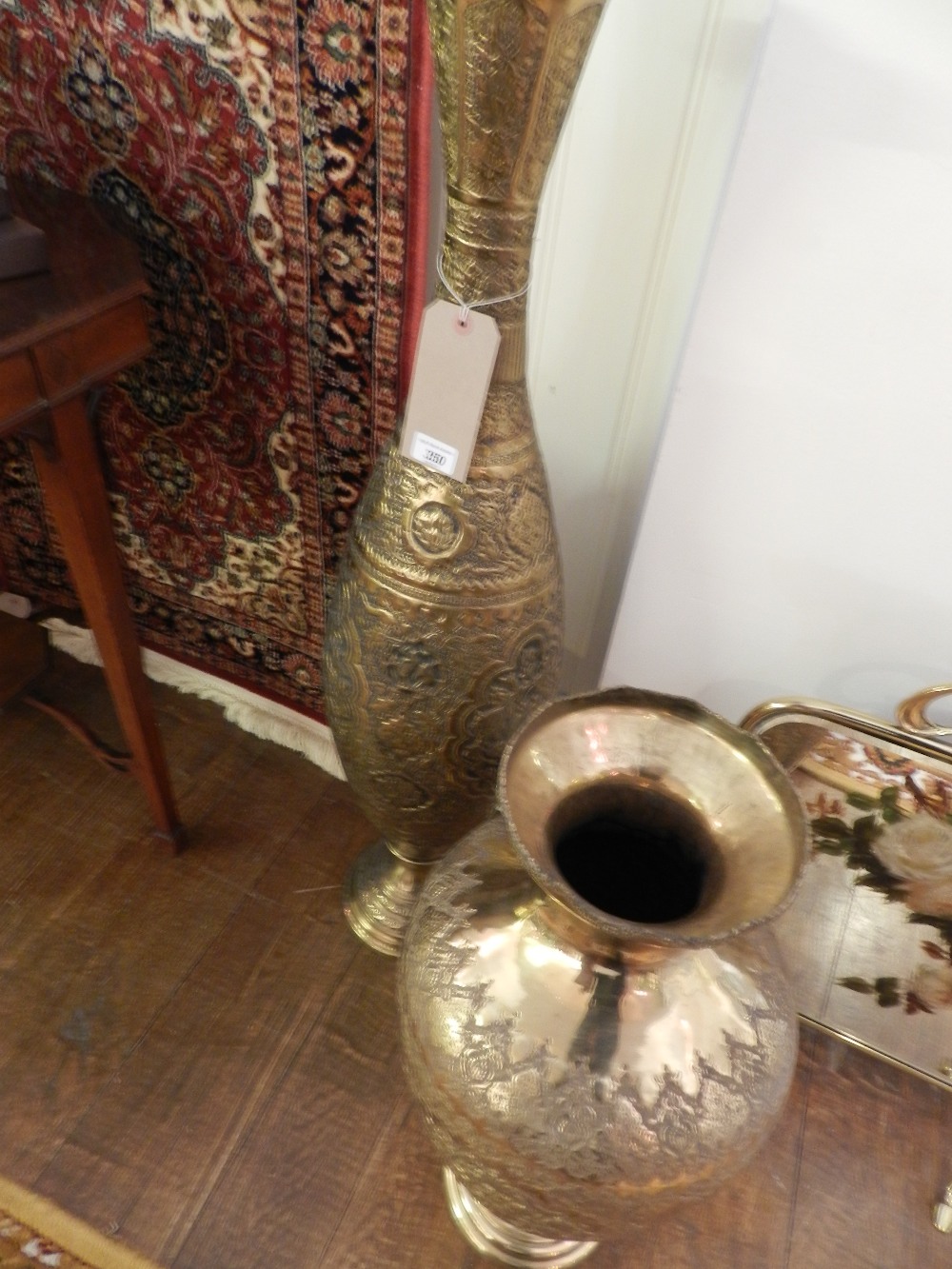 A pair of giant Persian tooled brass vases.