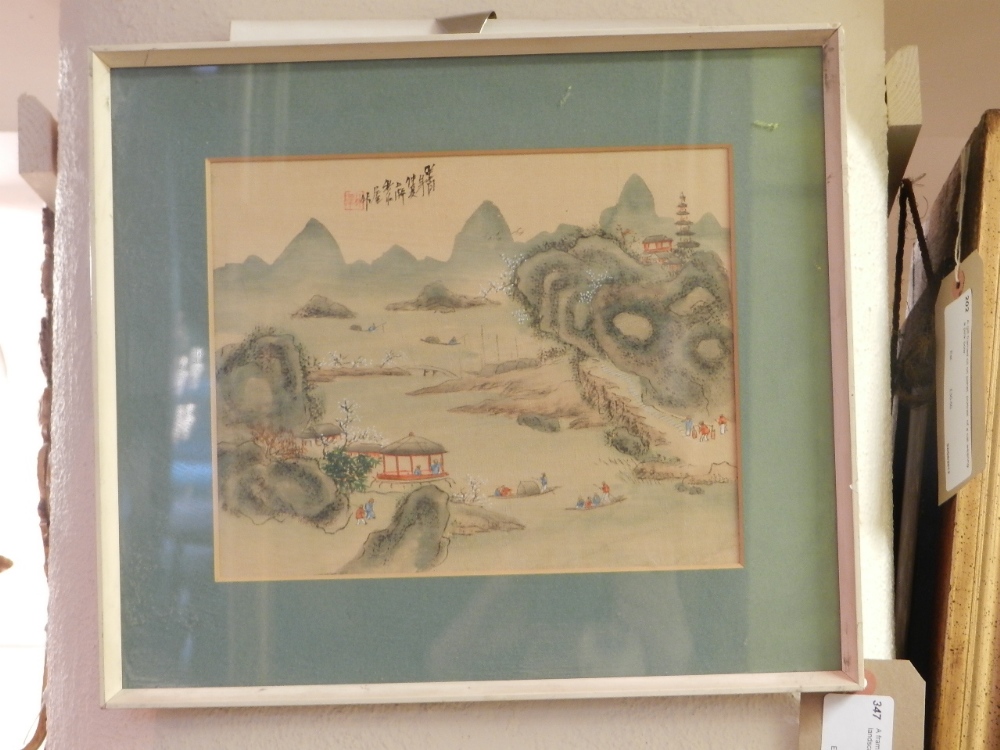 A framed and glazed oriental oil on board of a river landscape view with figure bearing signature