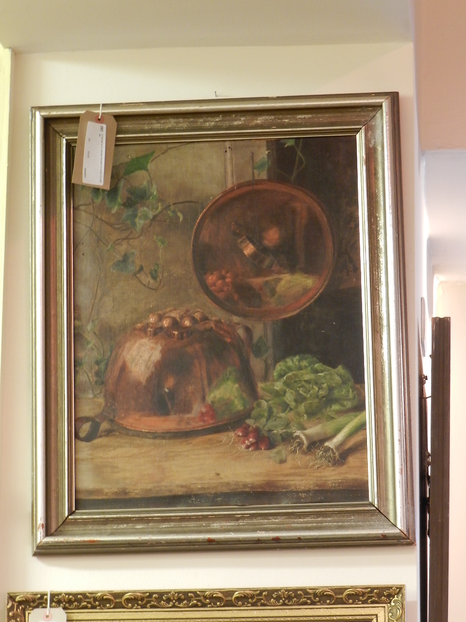 A framed oil on canvas mounted on board of a still life