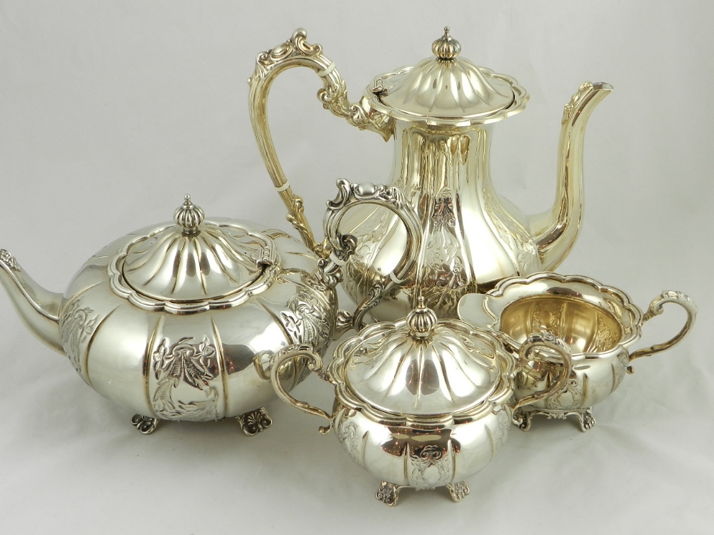 A Sterling silver four piece tea set, comprising of teapot, water jug, sucrier and creamer.