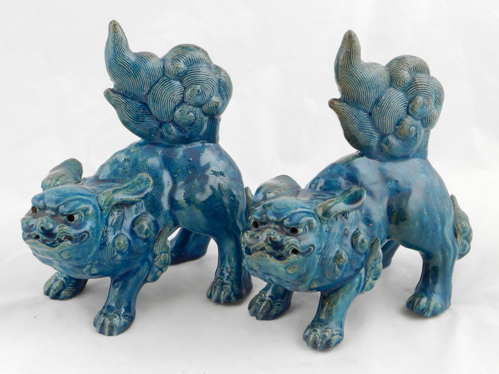 A pair of Chinese turquoise glazed stoneware kylins