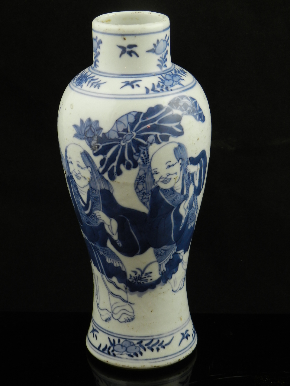 A Chinese 19th century blue and white baluster shaped vase decorated with figures in an idealized