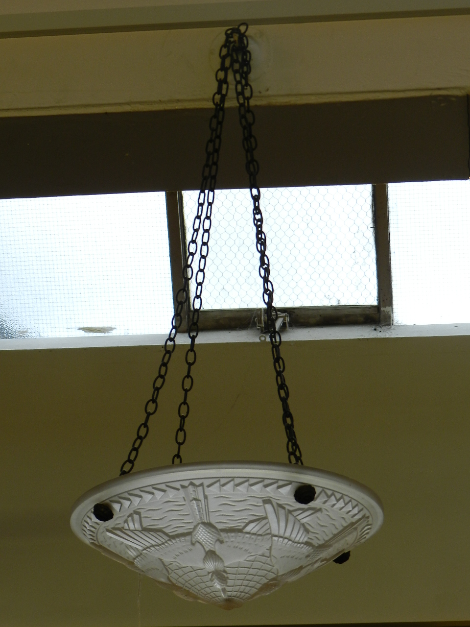 A French Art Deco frosted pressed glass ceiling light, decorated with doves.