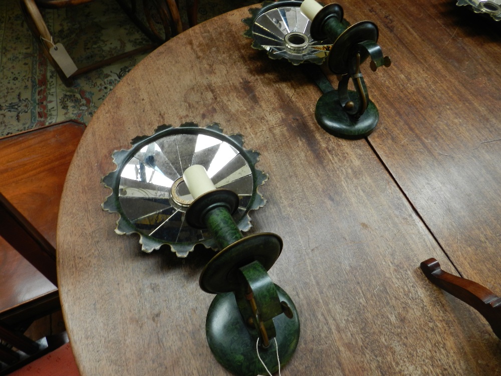 A set of four painted mottled green tole ware mirrored wall lights by Vaughans of London.