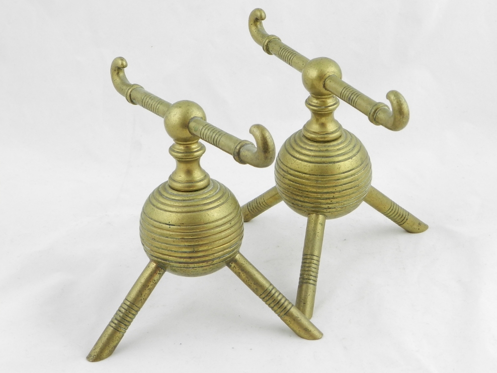 A pair of Christopher Dresser Designs brass fire dogs