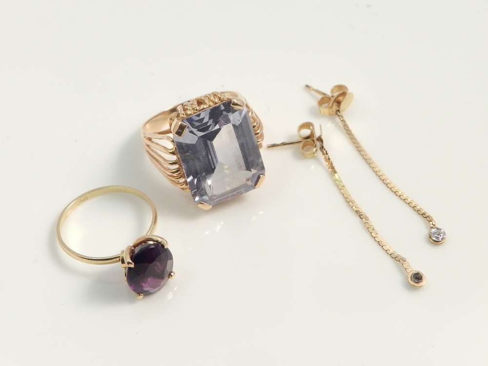 An Amethyst mounted 18ct gold ladies ring together with one other ring set with emerald cut blue