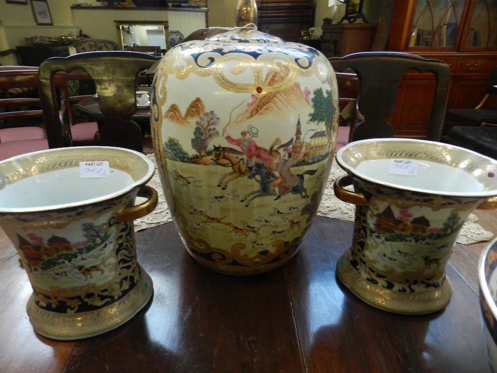 A large Chinese porcelain ginger jar with cover decorated with gilt enriched panels of hunting