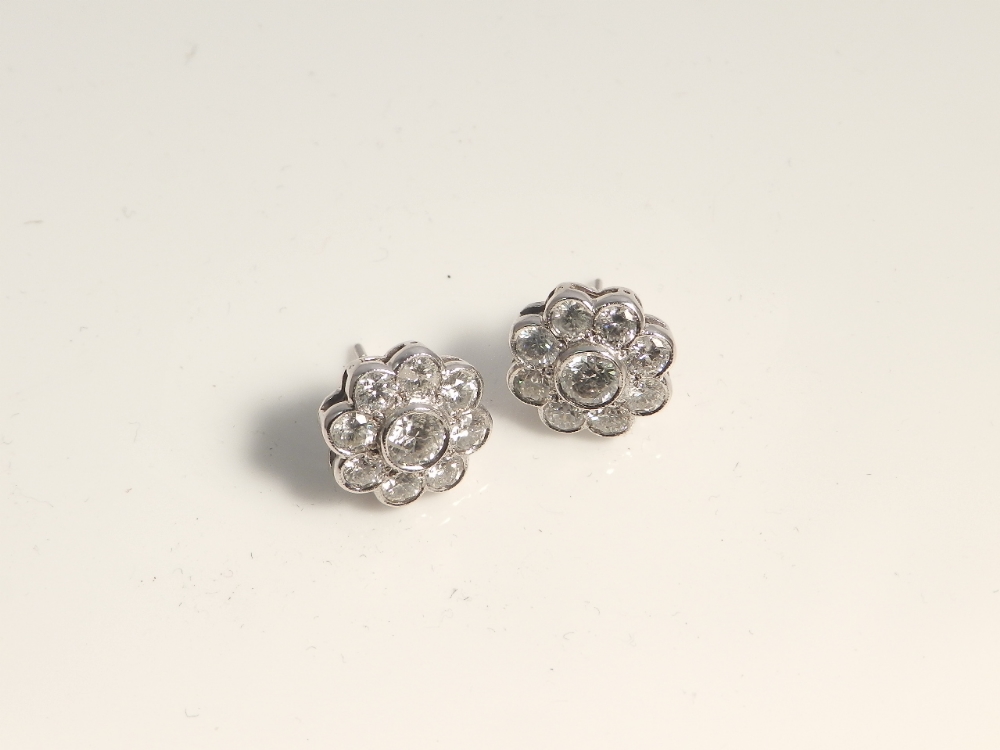 A pair of 18ct white gold and diamond flower cluster earrings approx 2.60 ct